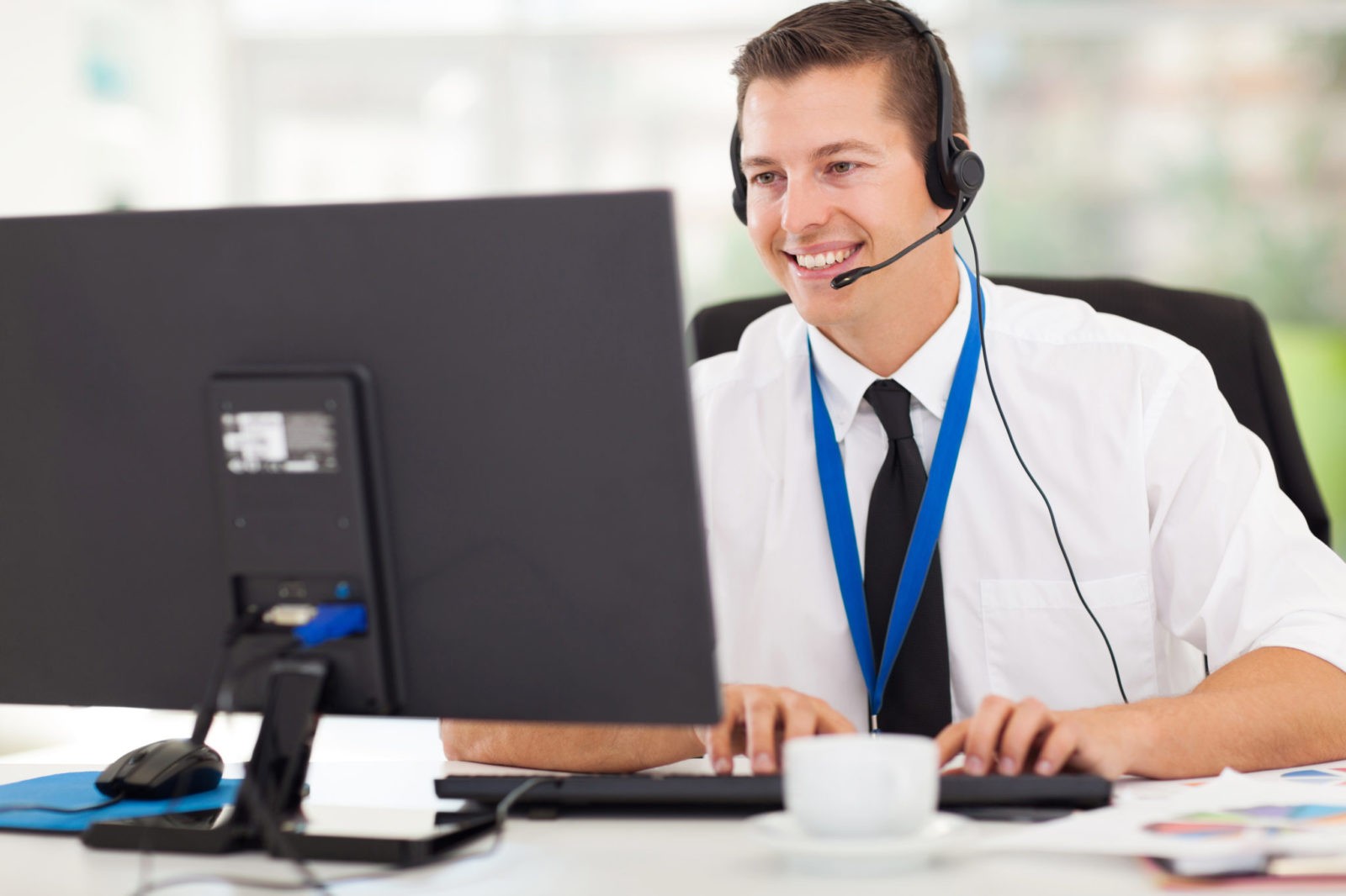 handsome technical support operator working on computer